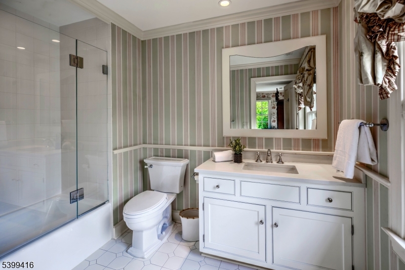 46 Sand Spring Road Morristown, NJ 07960 - Photo 26 of 38 a bathroom with a toilet sink and mirror