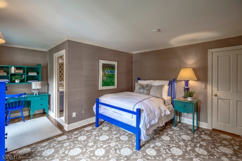 46 Sand Spring Road Morristown, NJ 07960 - Photo 28 of 38 a bedroom with a bed and a table in it