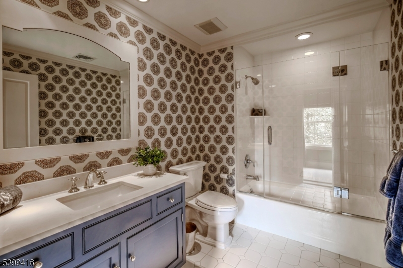 46 Sand Spring Road Morristown, NJ 07960 - Photo 29 of 38 a bathroom with a sink and a mirror