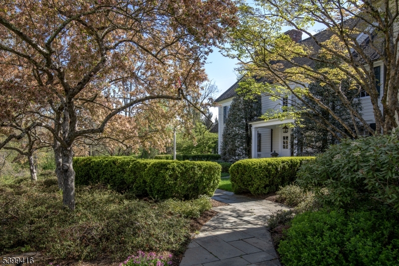 46 Sand Spring Road Morristown, NJ 07960 - Photo 6 of 38 a front view of a house with a yard