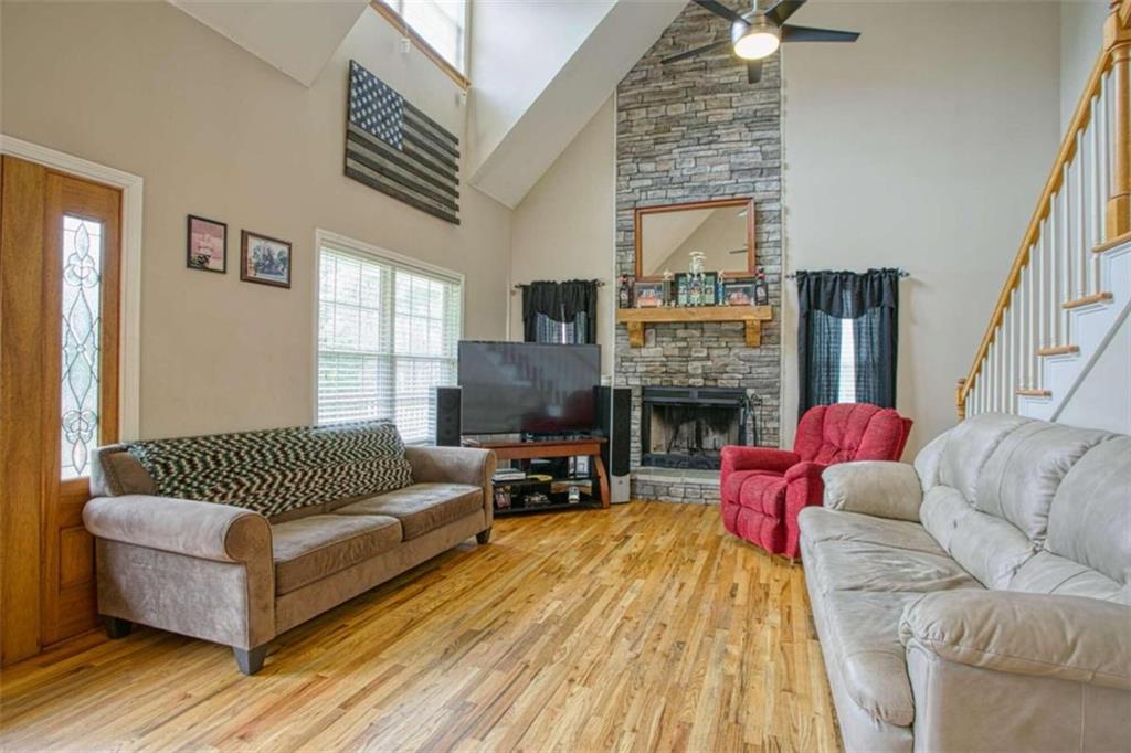 8392 Ephesus Church Road Villa Rica, GA 30180 - Photo 1 of 1 a living room with furniture and a fireplace