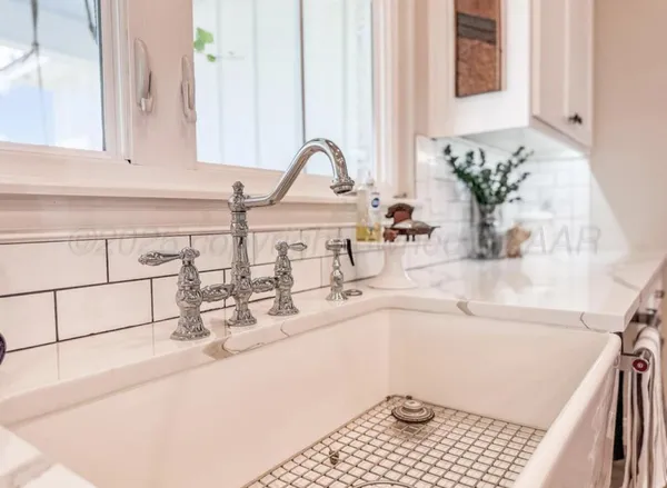 a kitchen with a sink and a window