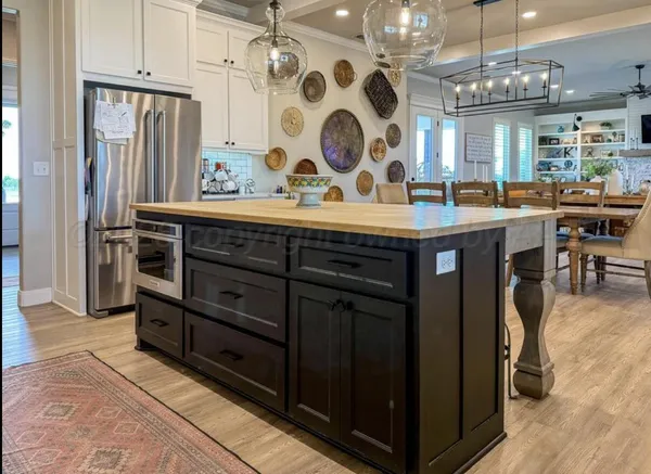 a view of hall way with furniture