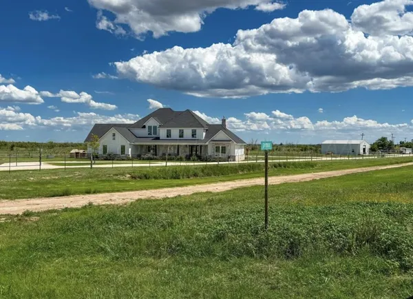 a view of a house with a big yard