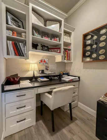 a kitchen with a sink cabinets and a table