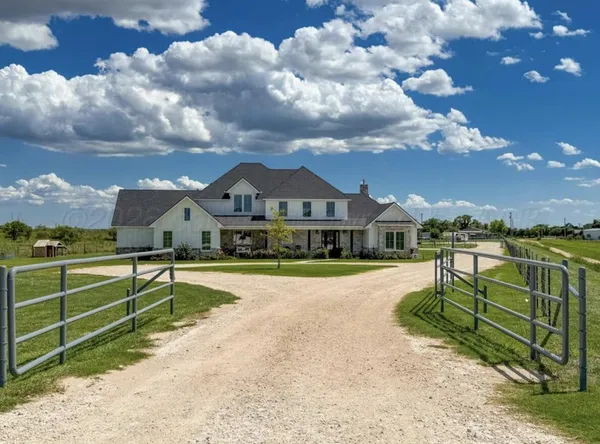 a view of a house with a big yard