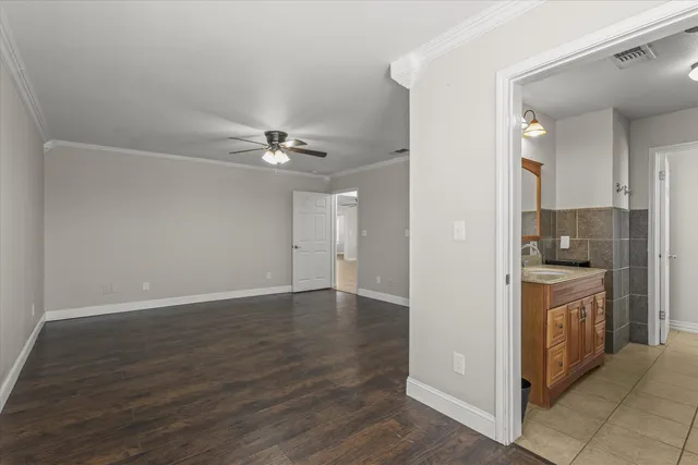 a bathroom with a granite countertop sink a shower and a mirror