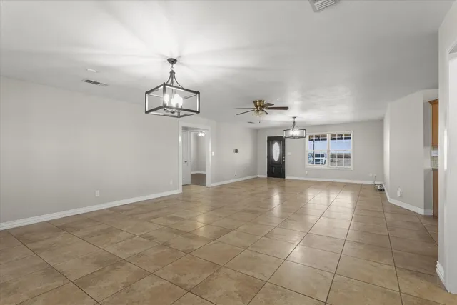 a view of a livingroom with a furniture and chandelier