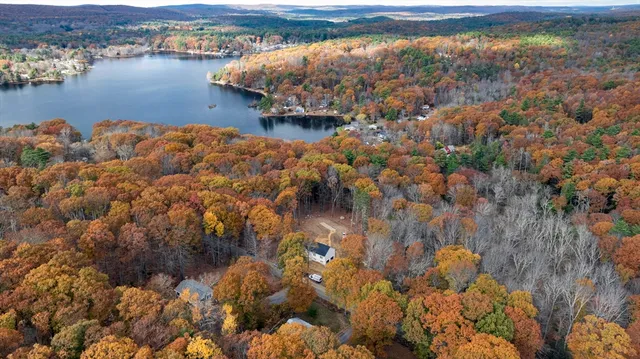 an aerial view of house with outdoor space and river