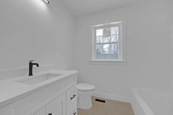 a view of room with wooden floor