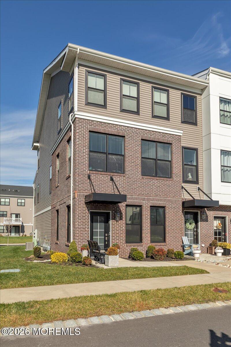 29 Midway Road North Tinton Falls, NJ 07724 - Photo 12 of 37 a view of a brick house with a yard in front of it