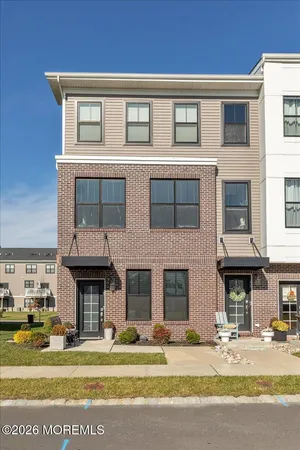 a front view of a building and a yard