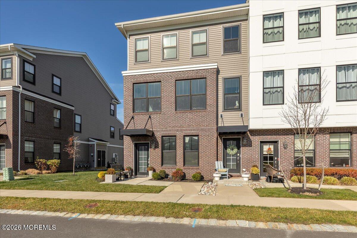 29 Midway Road North Tinton Falls, NJ 07724 - Photo 21 of 37 a front view of a building and a yard