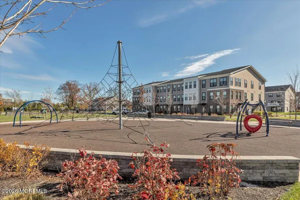 a view of a terrace with glass top table and chairs