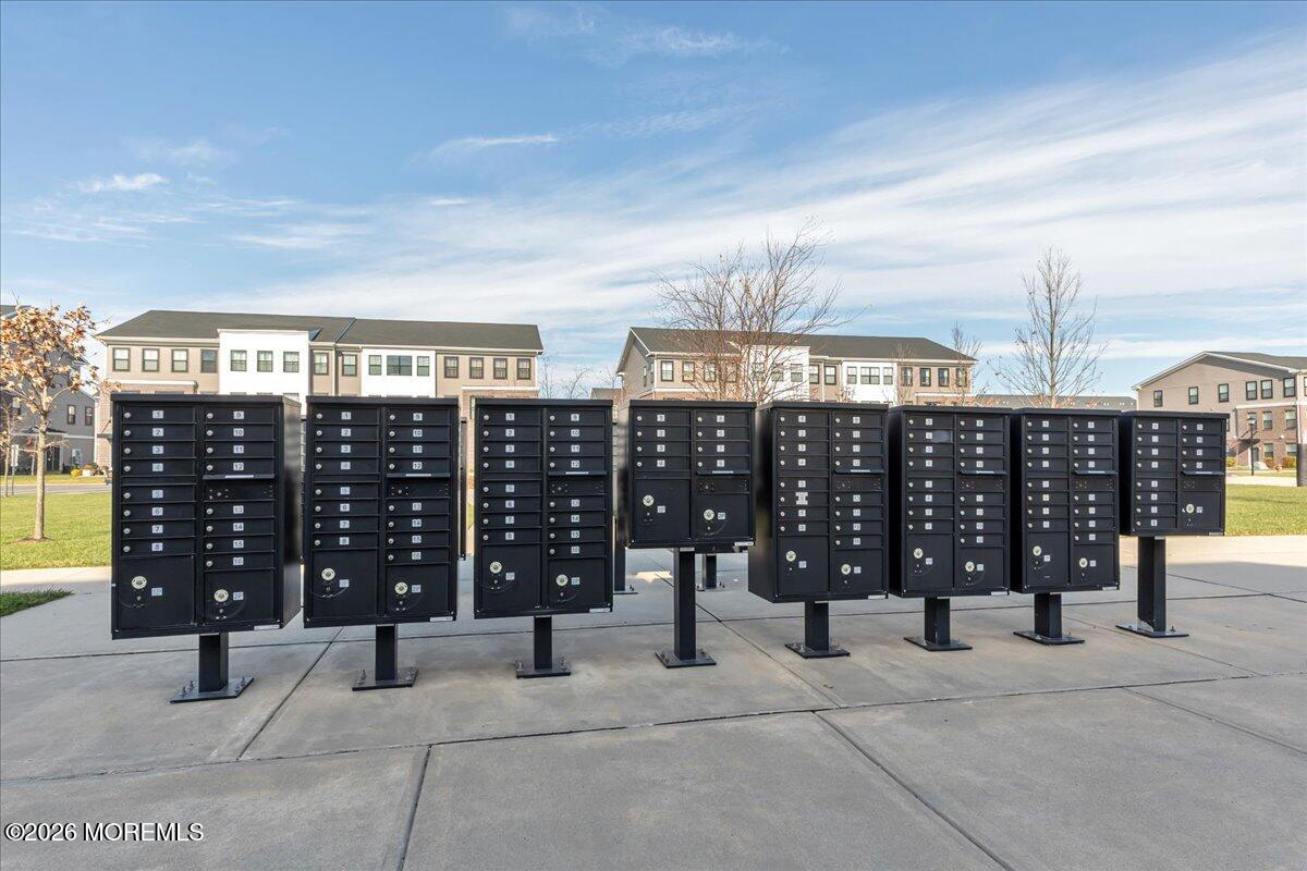 29 Midway Road North Tinton Falls, NJ 07724 - Photo 27 of 37 a view of a terrace with glass top table and chairs