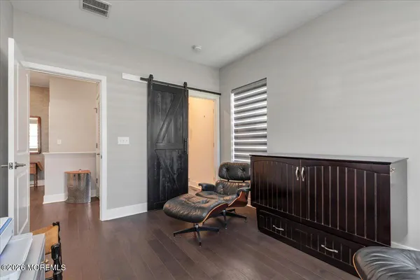 a view of a livingroom with furniture and wooden floor