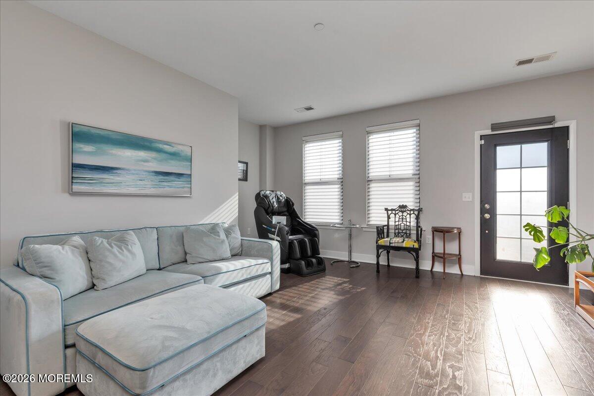 29 Midway Road North Tinton Falls, NJ 07724 - Photo 4 of 37 a living room with furniture and wooden floor