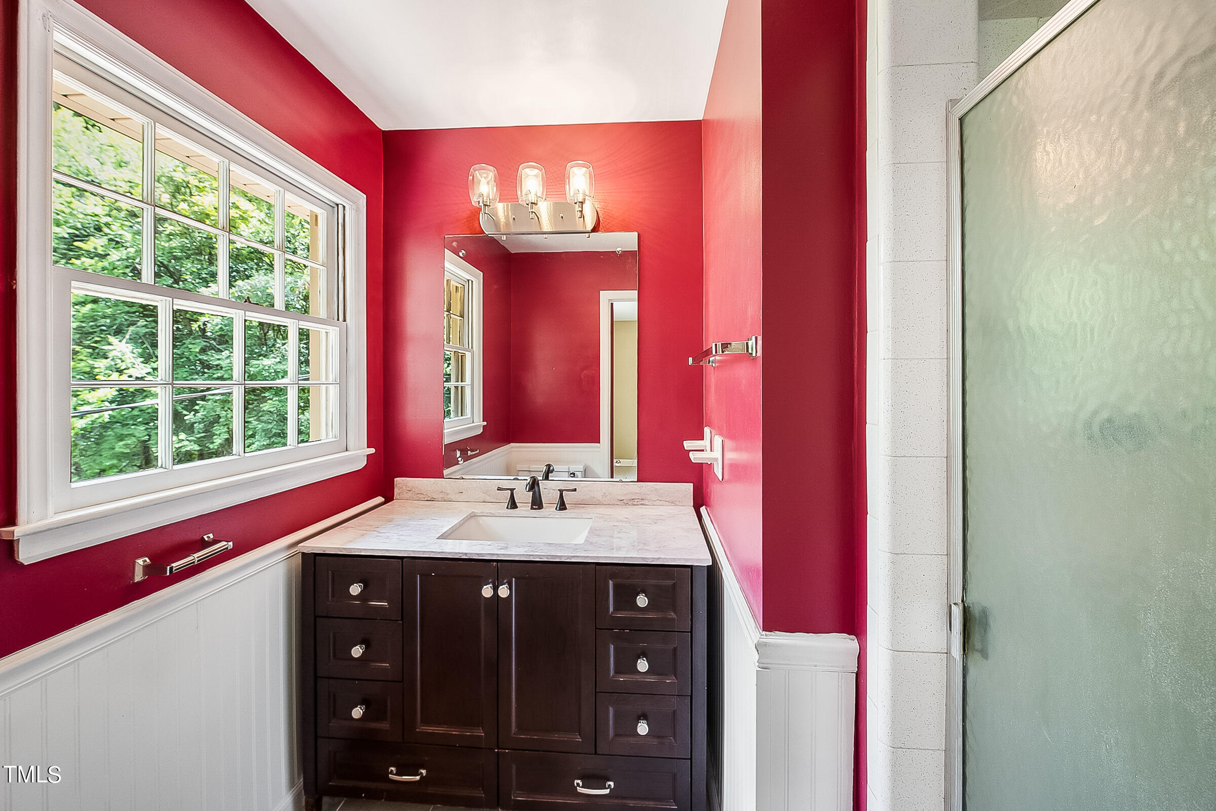 2512 Sparger Road Durham, NC 27705 - Photo 14 of 29 a bathroom with a sink and a mirror
