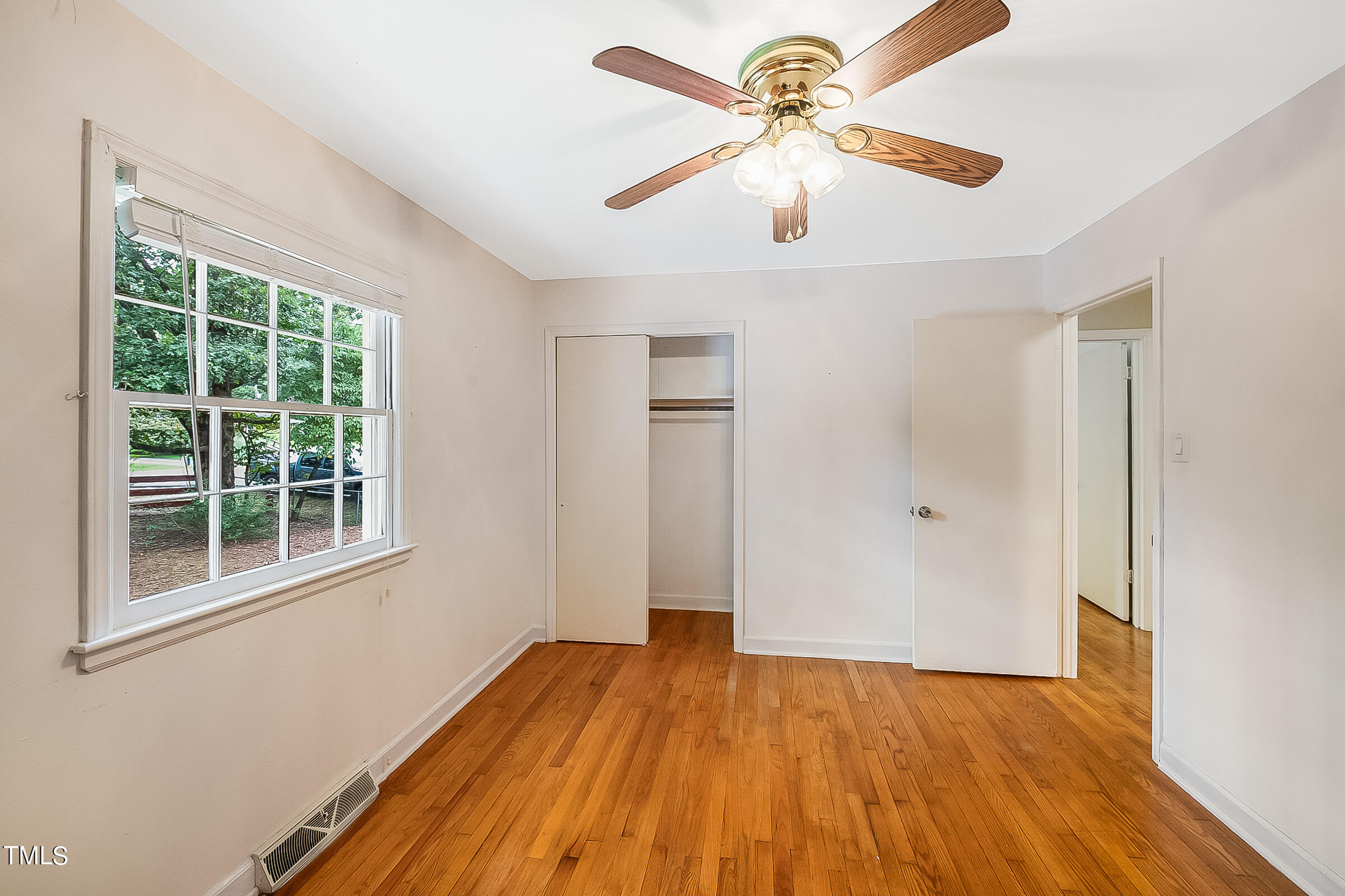 2512 Sparger Road Durham, NC 27705 - Photo 19 of 29 wooden floor in an empty room with a window