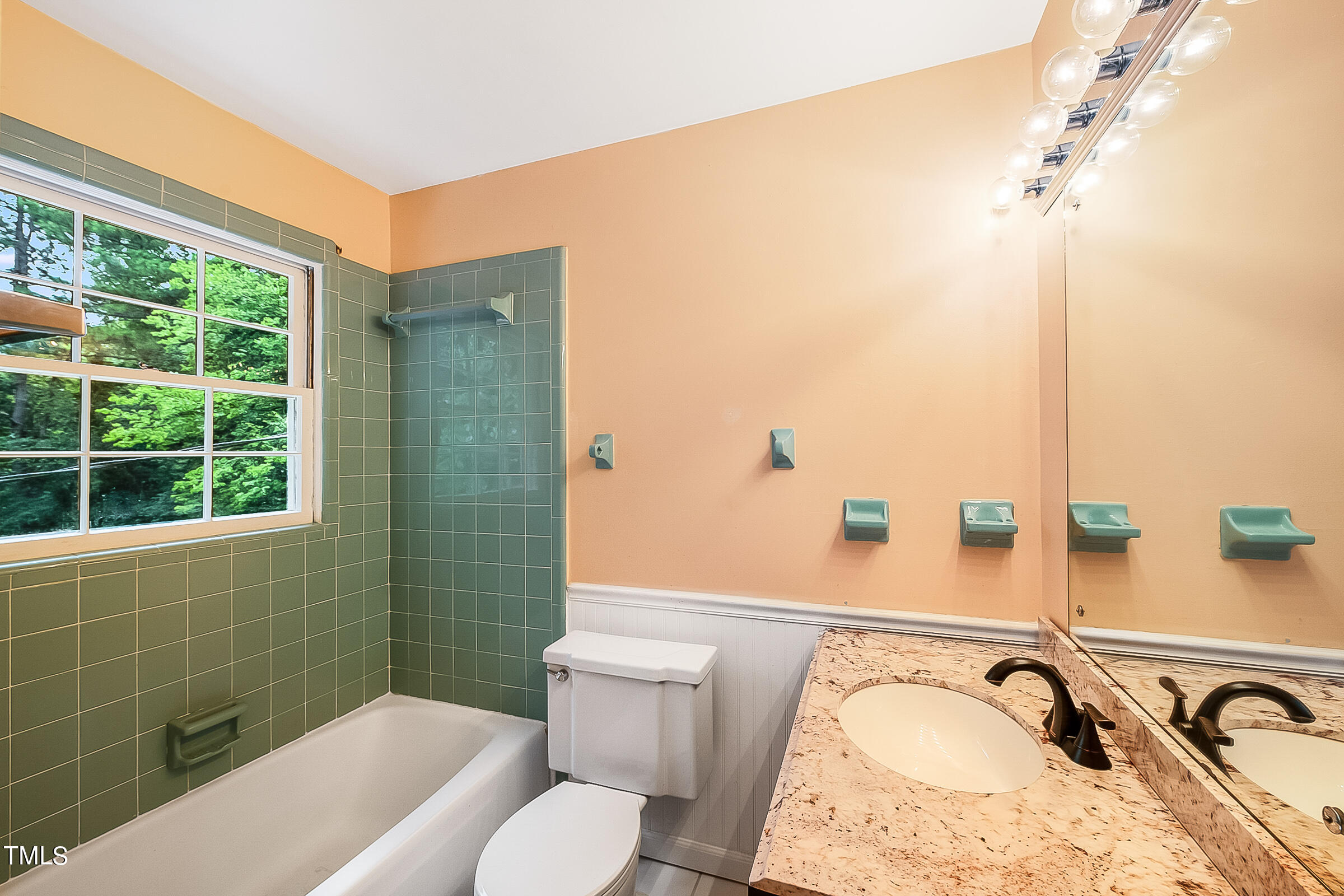 2512 Sparger Road Durham, NC 27705 - Photo 20 of 29 a bathroom with a sink and a mirror