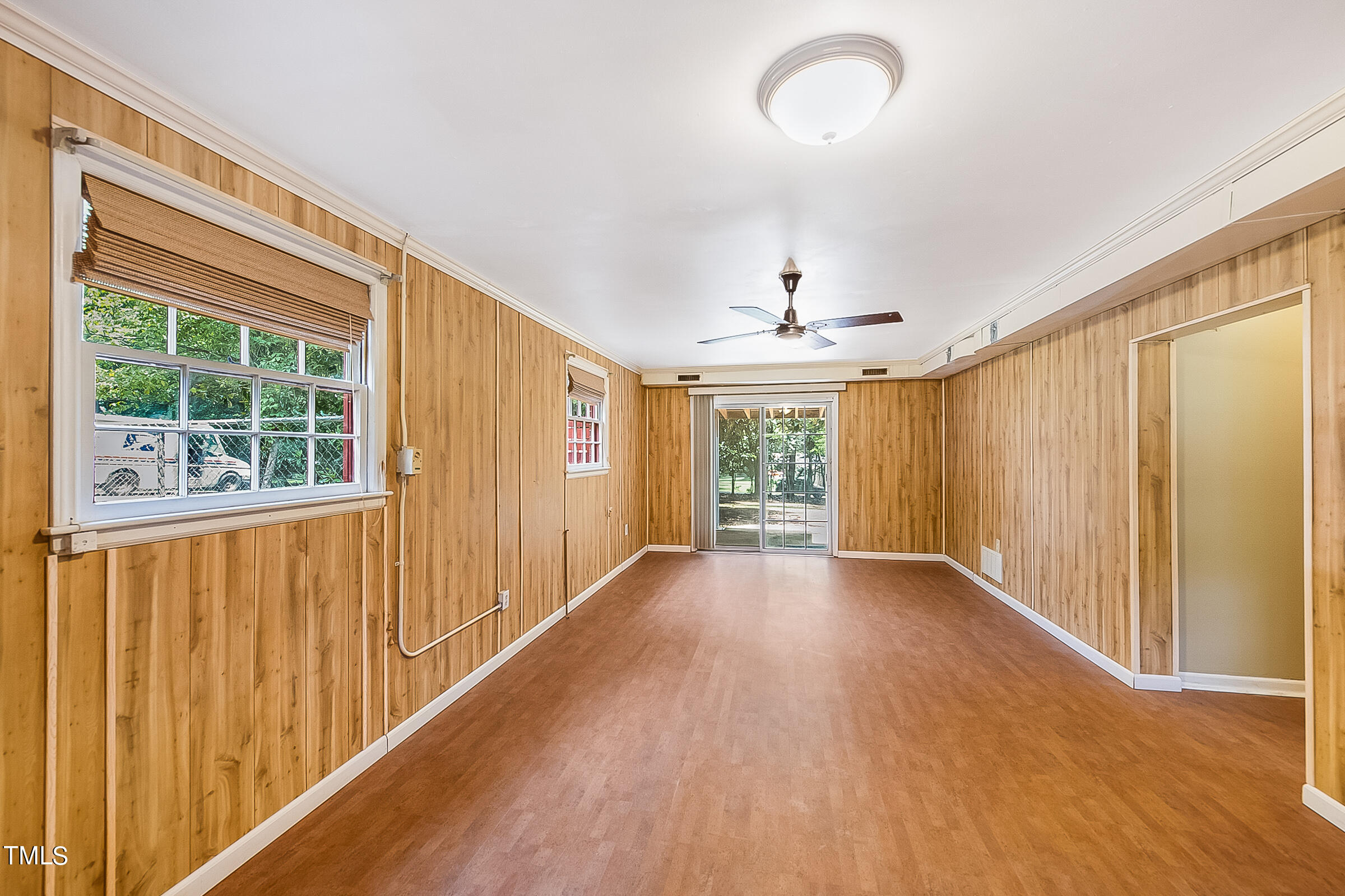 2512 Sparger Road Durham, NC 27705 - Photo 22 of 29 a view of an empty room with wooden floor and a window