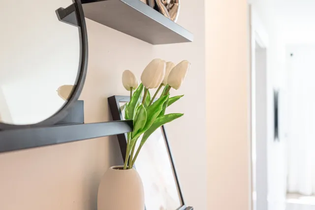 a living room with furniture and wooden floor