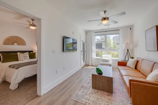 a bedroom with a large bed and a large window