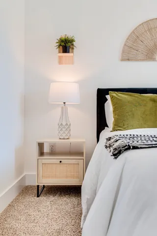 a bedroom with furniture and a window