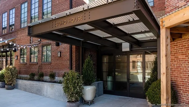 a view of a building with a yard