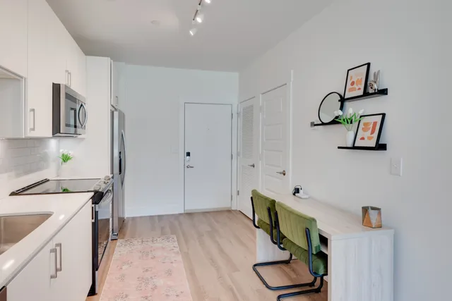 a kitchen with a refrigerator and sink