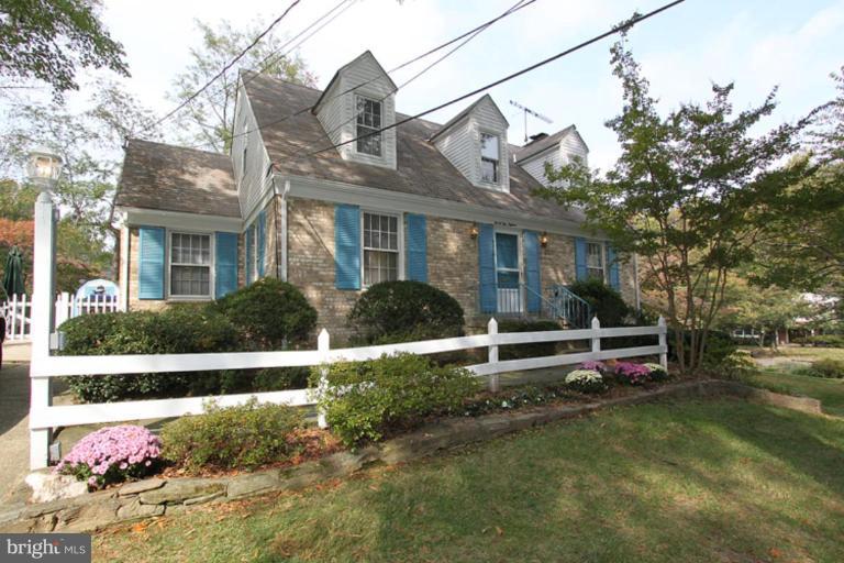 9518 Clement Road Silver Spring, MD 20910 - Photo 1 of 27 a front view of a house with a garden