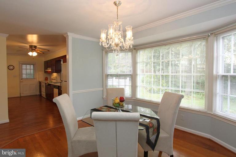 9518 Clement Road Silver Spring, MD 20910 - Photo 12 of 27 a view of a dining room with furniture window and outside view