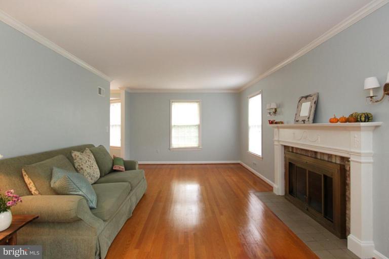 9518 Clement Road Silver Spring, MD 20910 - Photo 20 of 27 a living room with furniture and a fireplace