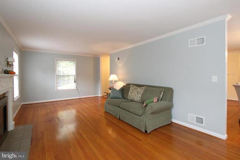 9518 Clement Road Silver Spring, MD 20910 - Photo 22 of 27 a living room with furniture and a window