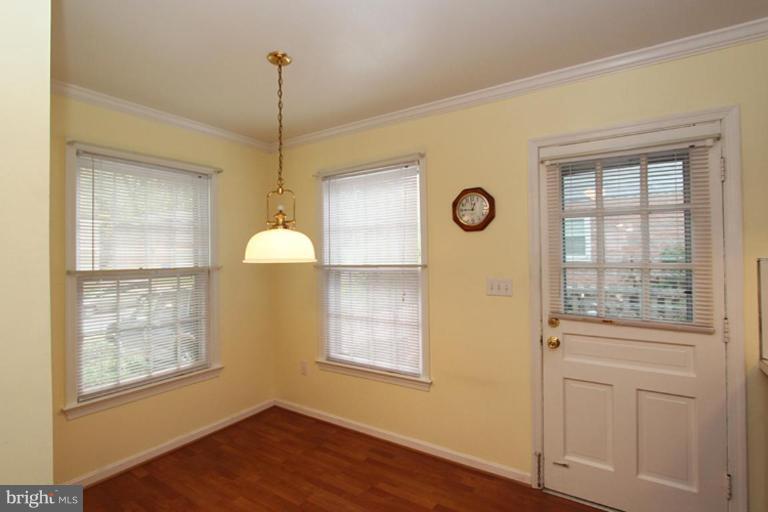 9518 Clement Road Silver Spring, MD 20910 - Photo 4 of 27 a view of an entryway with wooden floor and cabinet