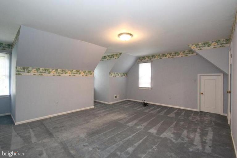 9518 Clement Road Silver Spring, MD 20910 - Photo 6 of 27 an empty room with windows and closet
