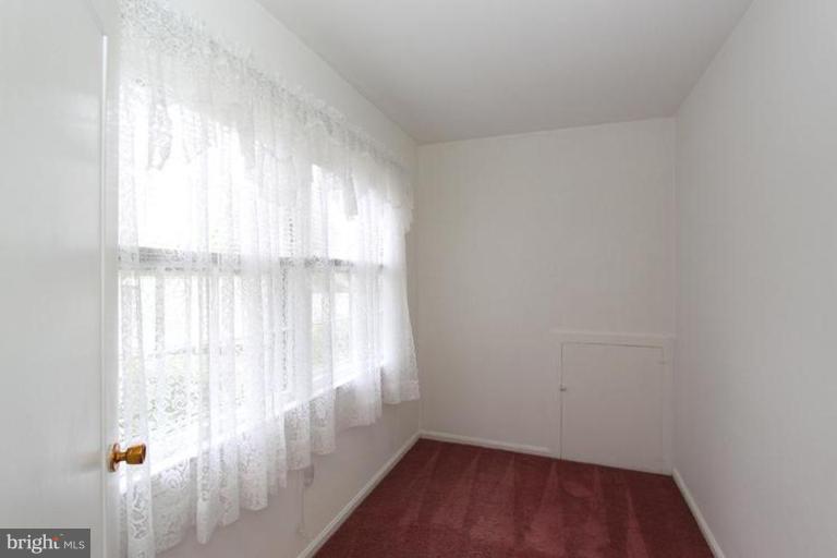 9518 Clement Road Silver Spring, MD 20910 - Photo 10 of 27 a view of an empty room and window