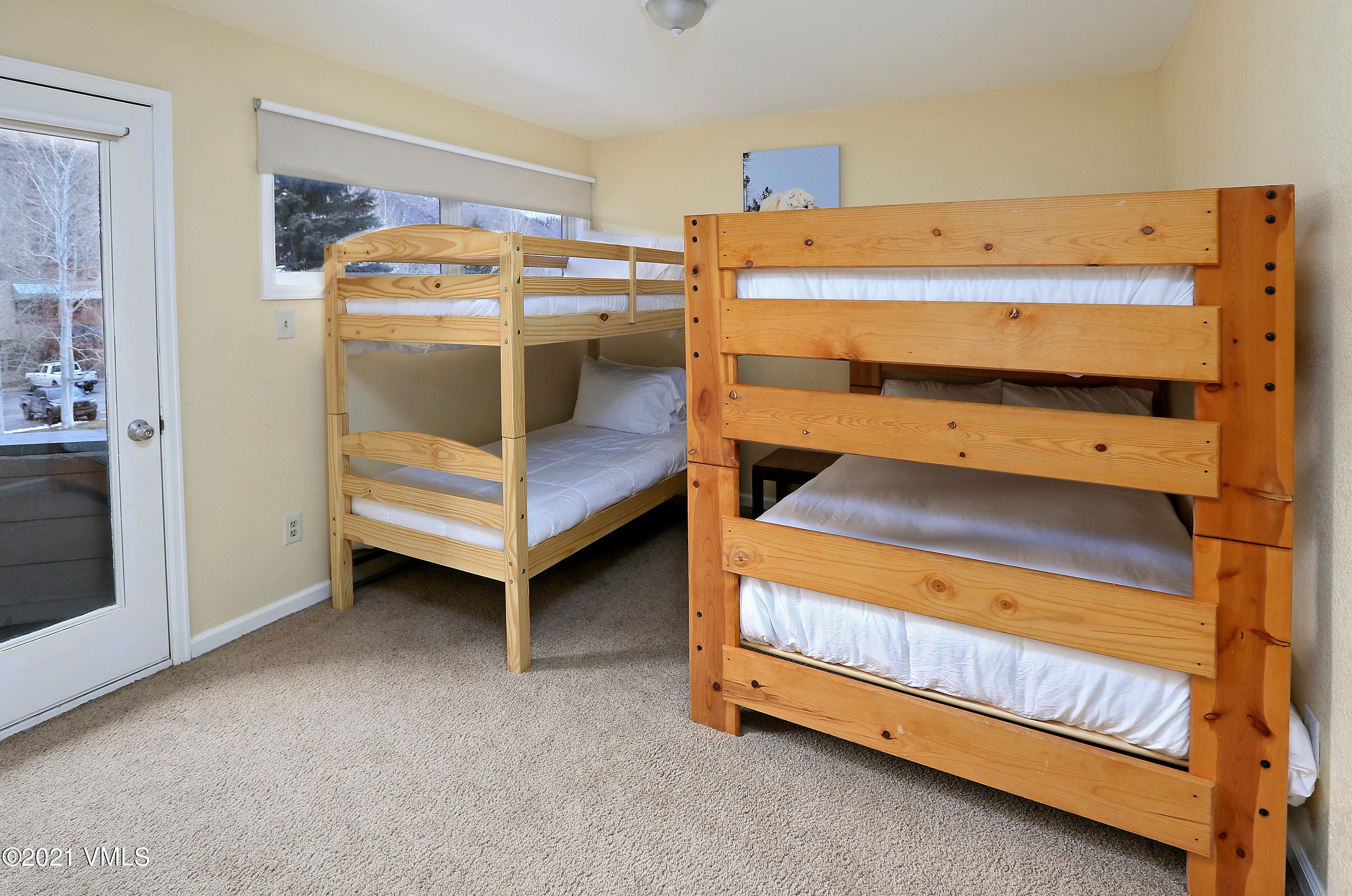 44 Eagle Road, Unit 2 Avon, CO 81620 - Photo 11 of 17 a bedroom with a bunk bed and a dresser