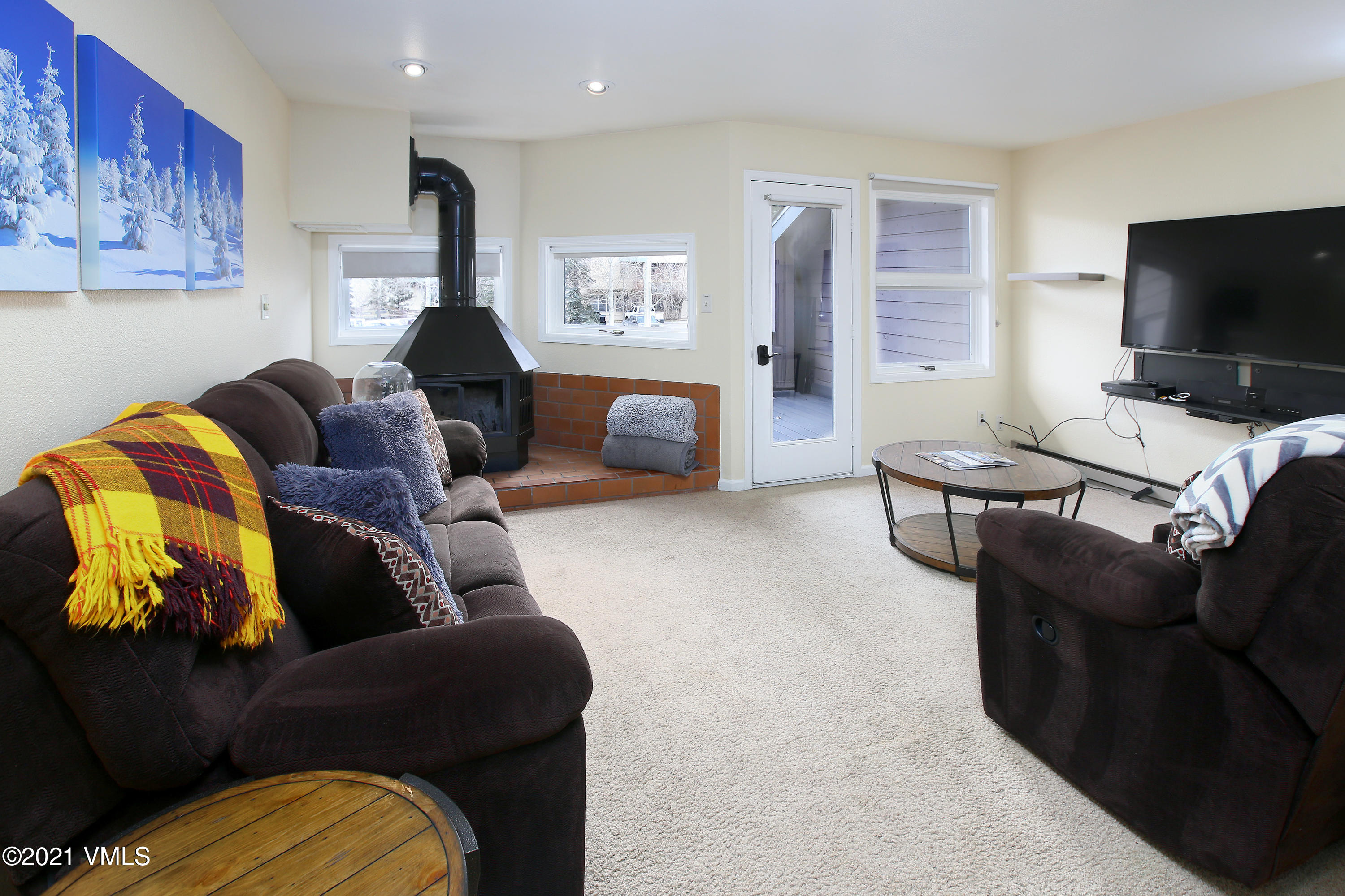 44 Eagle Road, Unit 2 Avon, CO 81620 - Photo 2 of 17 a living room with furniture and a flat screen tv