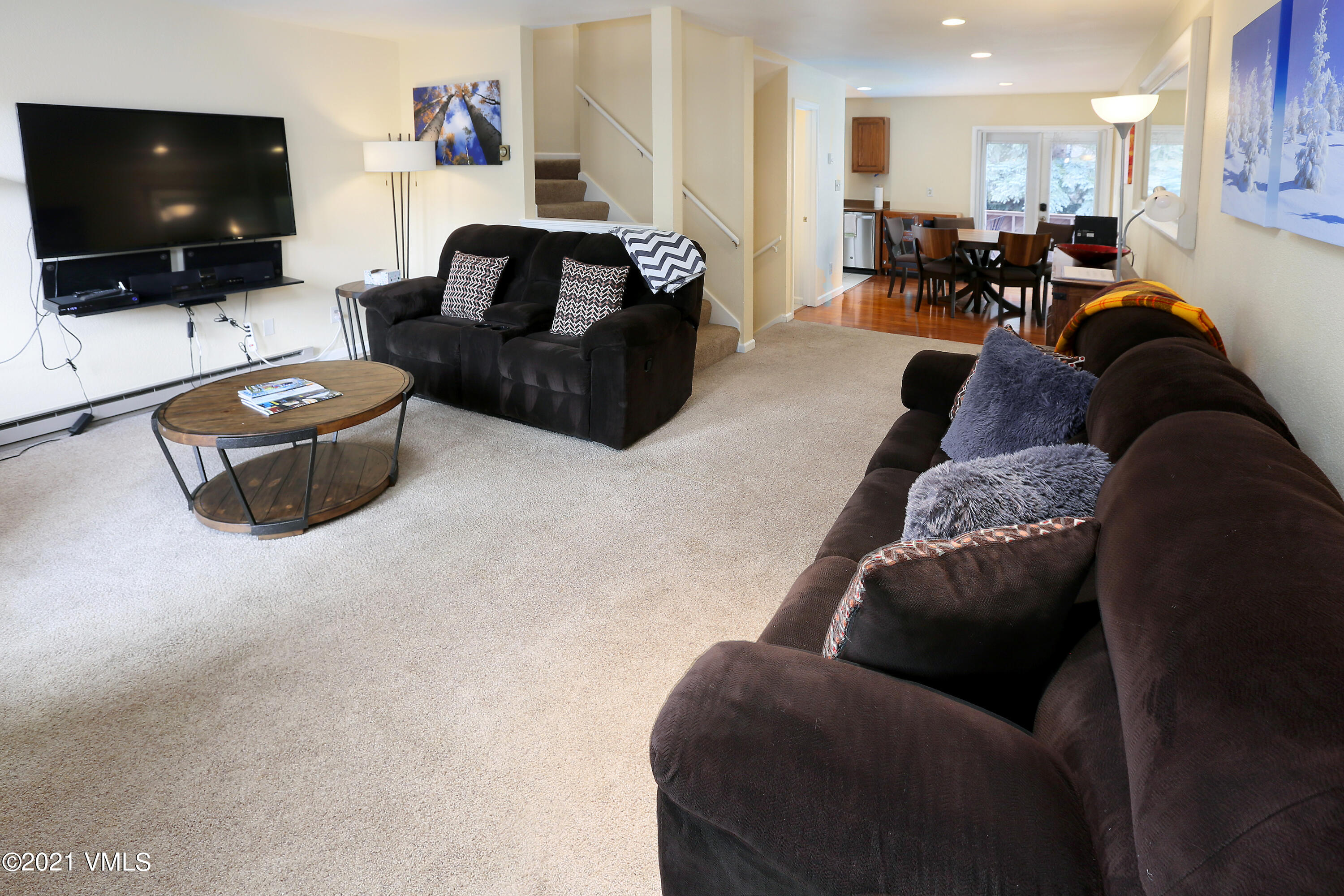 44 Eagle Road, Unit 2 Avon, CO 81620 - Photo 4 of 17 a living room with furniture and a flat screen tv