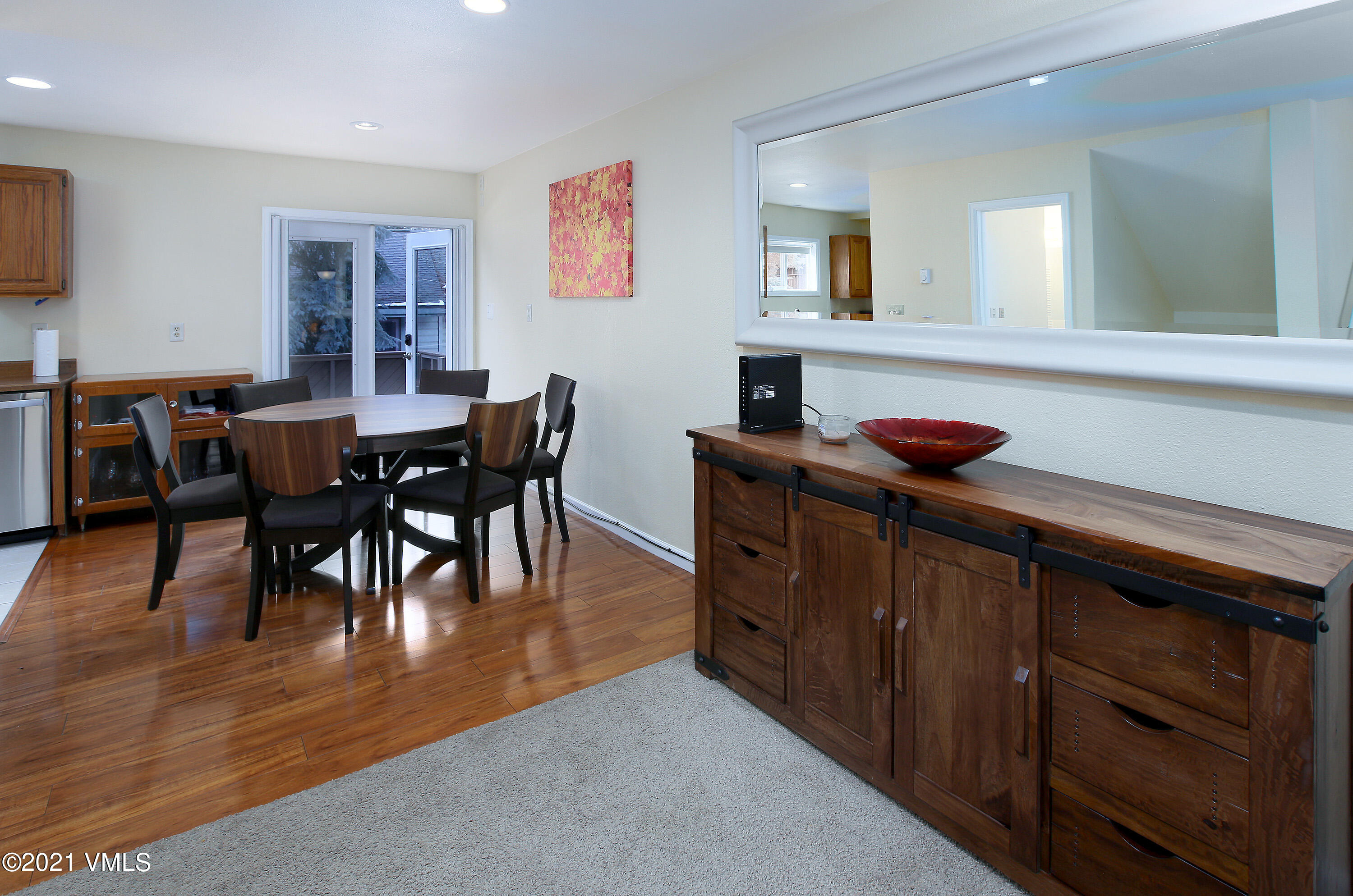 44 Eagle Road, Unit 2 Avon, CO 81620 - Photo 6 of 17 a view of a dining room with furniture and wooden floor
