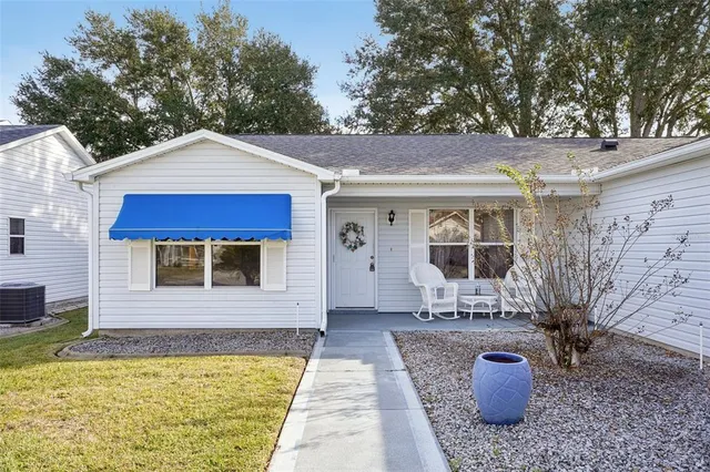 a front view of a house with yard