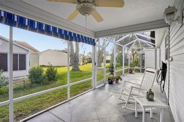 a building outdoor space with patio furniture and potted plants