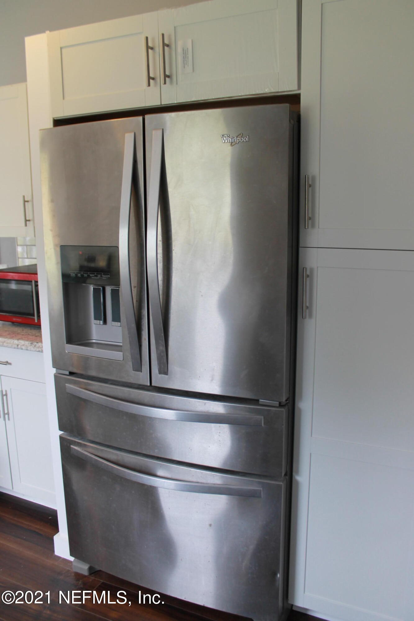 16006 Shellcracker Road Jacksonville, FL 32226 - Photo 11 of 41 a close view of refrigerator and cabinet