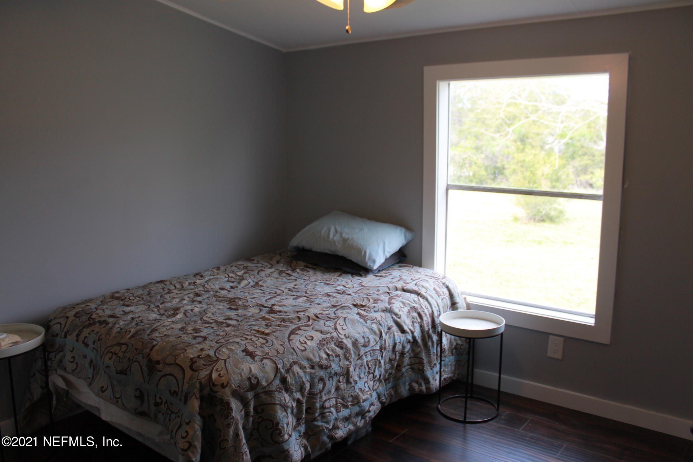 16006 Shellcracker Road Jacksonville, FL 32226 - Photo 16 of 41 a bedroom with a bed and a window