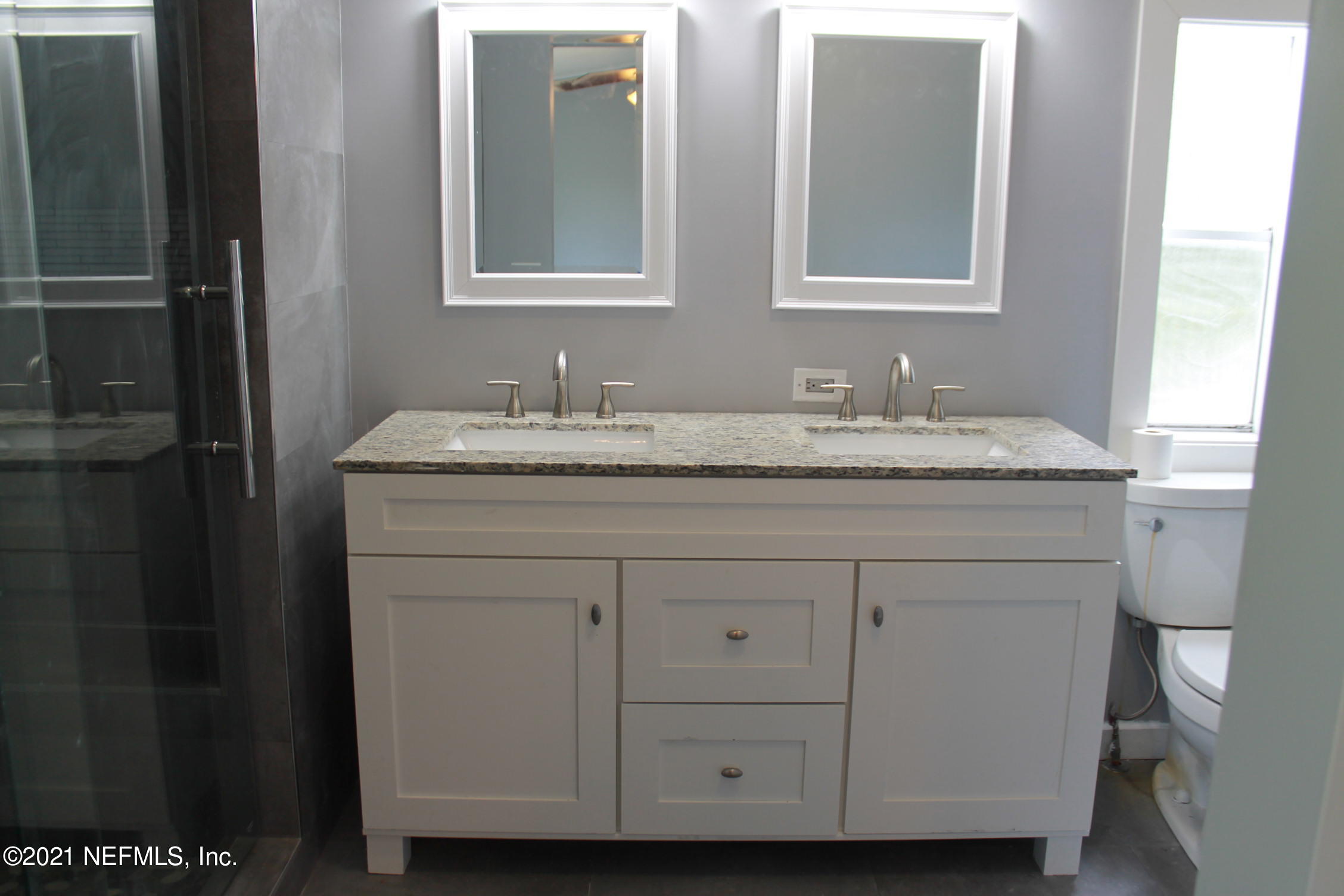 16006 Shellcracker Road Jacksonville, FL 32226 - Photo 18 of 41 a bathroom with a granite countertop sink and a mirror