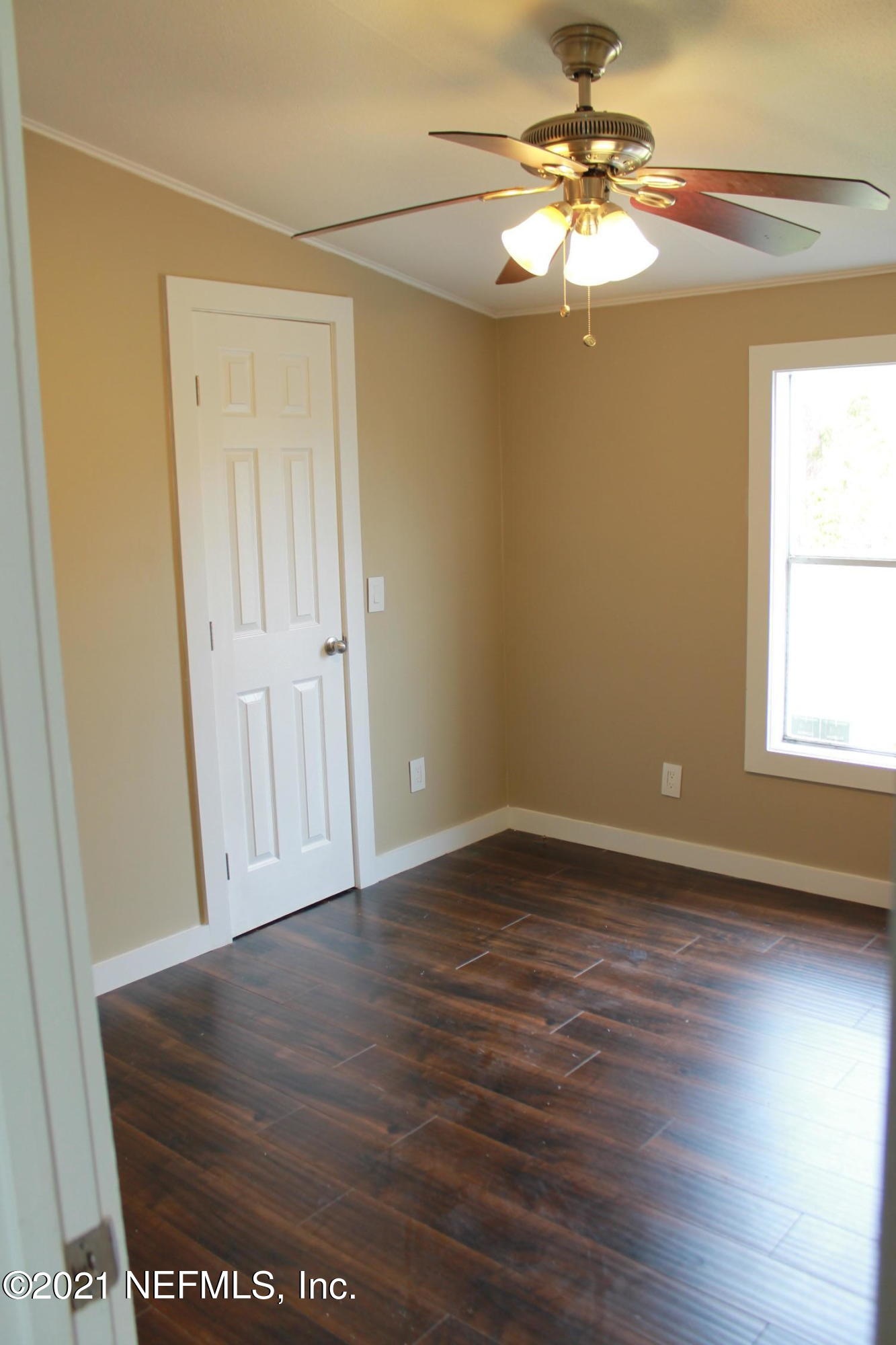 16006 Shellcracker Road Jacksonville, FL 32226 - Photo 26 of 41 wooden floor in an empty room with a window