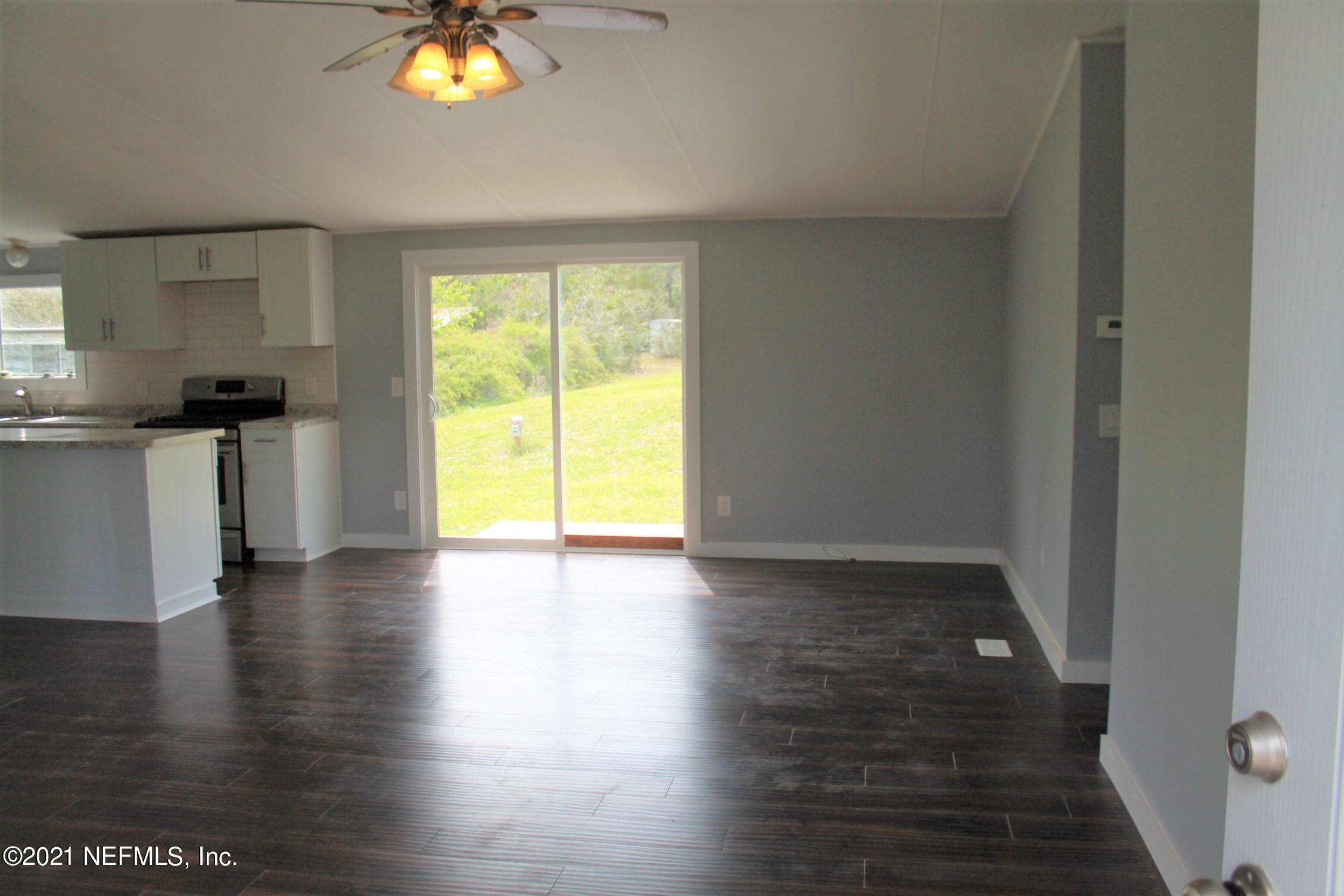 16006 Shellcracker Road Jacksonville, FL 32226 - Photo 3 of 41 a view of a kitchen with a stove wooden floor and a kitchen view