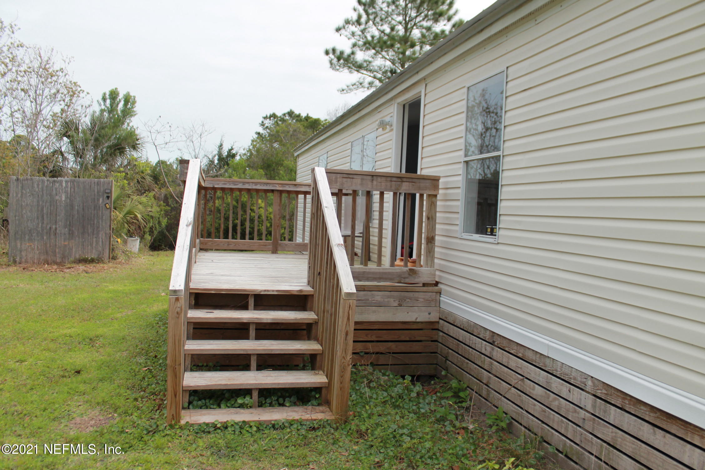 16006 Shellcracker Road Jacksonville, FL 32226 - Photo 31 of 41 a view of a house with backyard and wooden fence