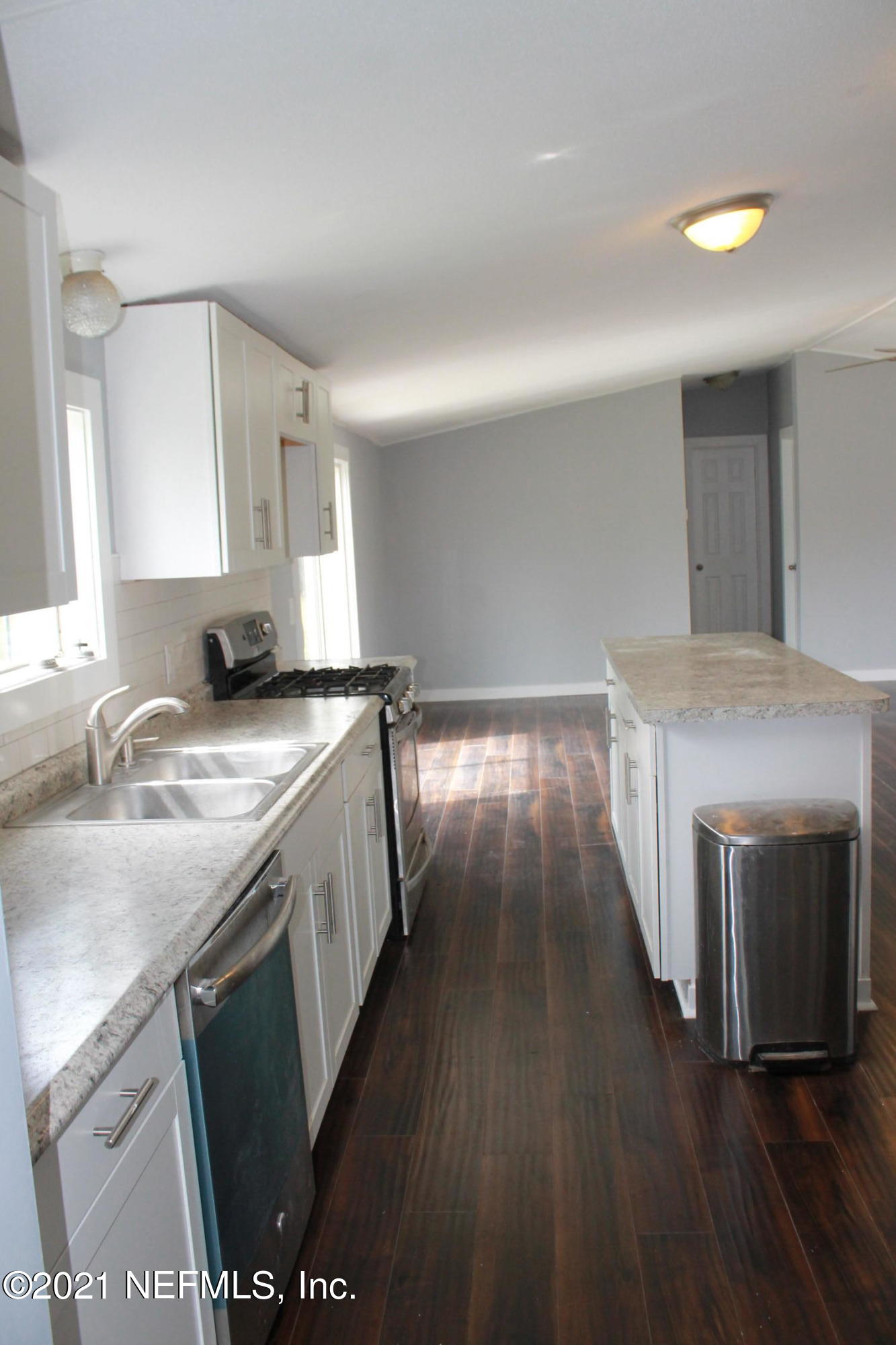 16006 Shellcracker Road Jacksonville, FL 32226 - Photo 8 of 41 a kitchen with a sink and a stove top oven